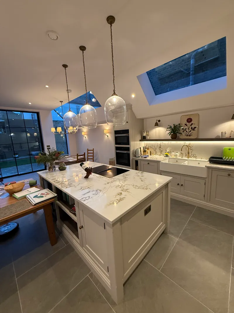 Open-plan kitchen extension with roof lights and pendant lighting