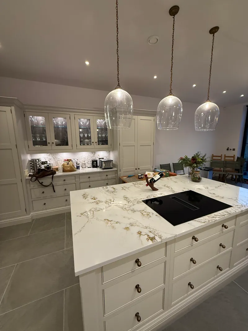 Marble-effect stone worktop and induction hob detail