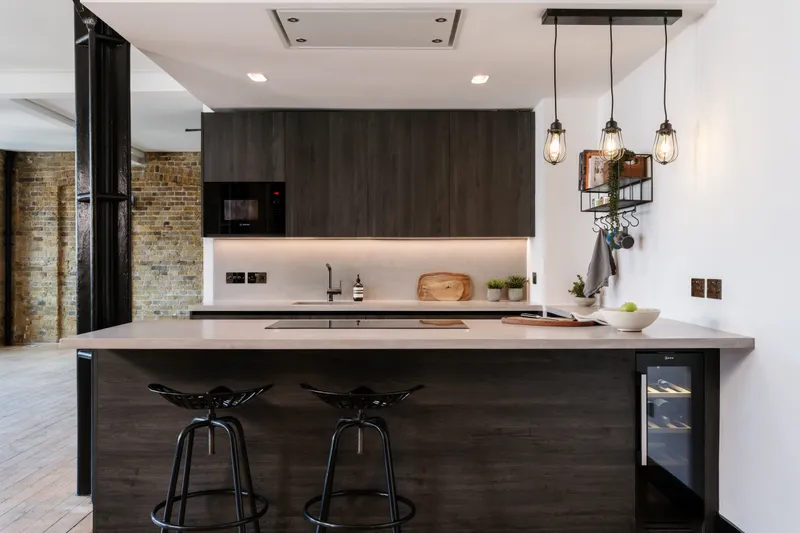 Bespoke black-timber kitchen with stone island