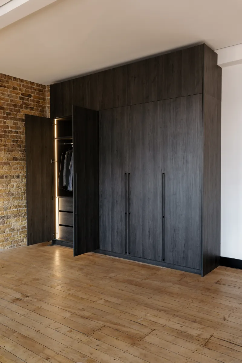 Walk-in dressing room with bespoke wardrobes