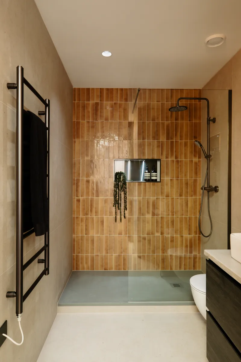 Terracotta-tiled walk-in shower